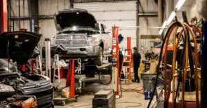 Mechanic in Red Deer performing a digital vehicle inspection in the shop